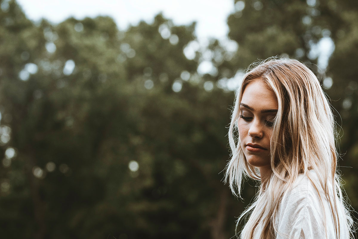 Young woman thinking about the safety of an online abortion
